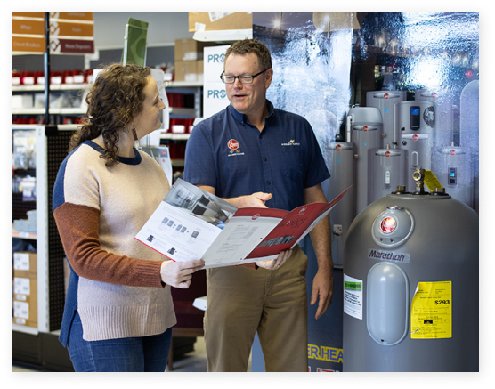 Our team member informing a customer about our water heaters